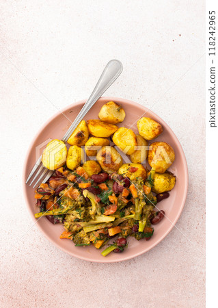 Stewed potatoes with stewed vegetables, broccoli and beans with carrots and herbs 118242965