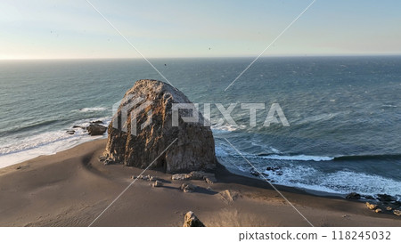 Large rocks natural monument Piedra de Iglecias Church stone on Chilean coast in Constitucion in sunset. 118245032