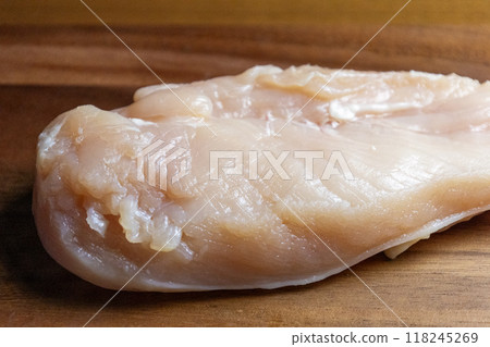 Chicken breasts on a wooden cutting board Chicken breasts on a wooden cutting board 118245269