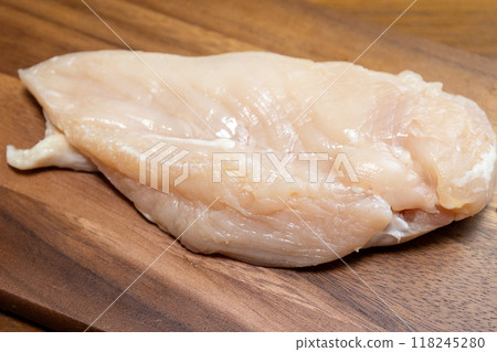 Chicken breasts on a wooden cutting board Chicken breasts on a wooden cutting board 118245280