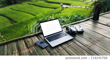 White screen notebook computer on bamboo balcony. Working outside the office concept. 118245708