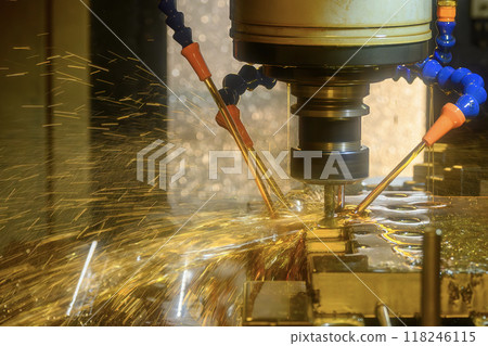 Close up scene the CNC milling machine cutting the shell mold parts with oil coolant method. Close up scene the CNC milling machine cutting the shell mold parts with oil coolant method. 118246115
