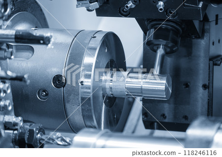 The turn-mill machine cutting the metal shaft parts by milling spindle.. The turn-mill machine cutting the metal shaft parts by milling spindle.. 118246116