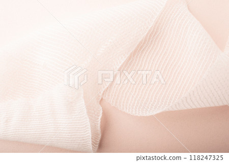 Bandage close up on pink background. Bandage texture. Treatment wounds. Applying plaster to the fracture. Medical concept banner. Copy space. High quality photo Bandage close up on pink background. Bandage texture. Treatment wounds. Applying plaster to the fracture. Medical concept banner. Copy space. High quality photo 118247325