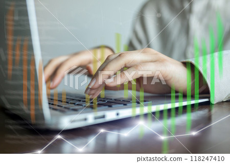 A person is typing on a laptop with a green line on the screen A person is typing on a laptop with a green line on the screen 118247410