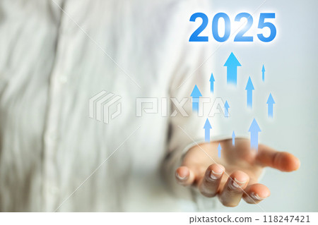 A person is holding a hand up with a blue and white background 2025 concept 118247421