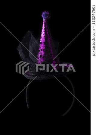 Halloween hat shiny on black background.Bright cap on the hoop. 118247602
