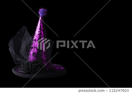 Halloween hat shiny on black background.Bright cap on the hoop. 118247603
