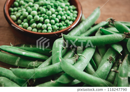 Bowl of green peas and organic green peas pods Bowl of green peas and organic green peas pods 118247790