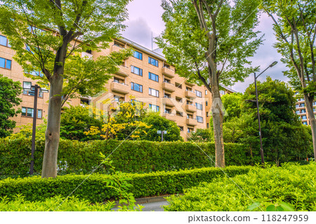 Tokyo cityscape in Japan, in front of Hiroo Station. View of Hiroo Garden Hills in Hiroo, Shibuya Ward, surrounded by greenery, from the Nishi-Azabu side of Minato Ward. 118247959