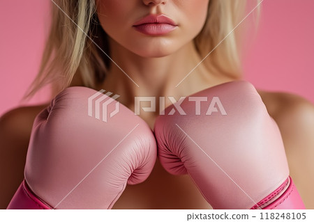 Woman wearing pink boxing gloves 118248105