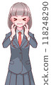 A high school girl in a uniform panics and puts her hand on her cheek 118248290