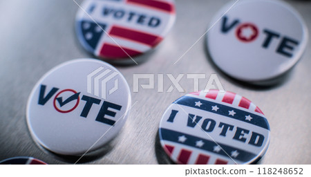Close up of patriotic badges with American flag logo and inscription Close up of patriotic badges with American flag logo and inscription 118248652