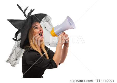 Young witch is shouting through a megaphone, possibly announcing Halloween or a spooky event Young witch is shouting through a megaphone, possibly announcing Halloween or a spooky event 118249094