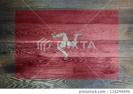 Isle of man flag on rustic old wood surface background 118249846