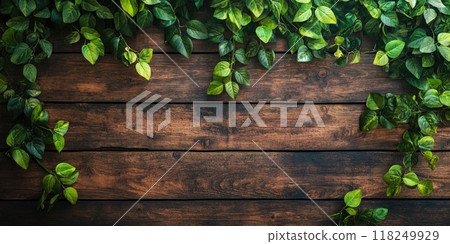 Rustic wooden wall with lush greenery close-up for nature-themed designs 118249929