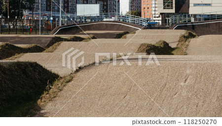 Empty BMX Race made from soil and sand. Adrenaline-Pumping Dirt BMX Race Track: A Rider's Paradise for Stunts and Speed. Extreme sport, bicycling concept Empty BMX Race made from soil and sand. Adrenaline-Pumping Dirt BMX Race Track: A Rider's Paradise for Stunts and Speed. Extreme sport, bicycling concept 118250270