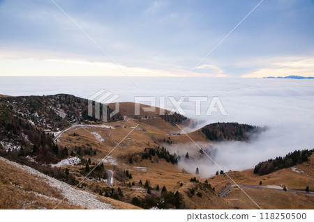 Mountain peaks emerging from the clouds Mountain peaks emerging from the clouds 118250500
