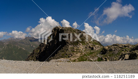 Rugged Mountain Peak Against a Clear Blue Sky Rugged Mountain Peak Against a Clear Blue Sky 118251189