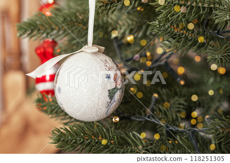 Holiday ball, sphere decoration, bauble on green fir tree branch Holiday ball, sphere decoration, bauble on green fir tree branch 118251305