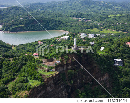 Jesus statue on rock cliff 118251654