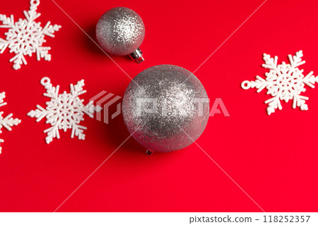 Christmas tree decorations and snowflakes on a red background - New Year's design Christmas tree decorations and snowflakes on a red background - New Year's design 118252357