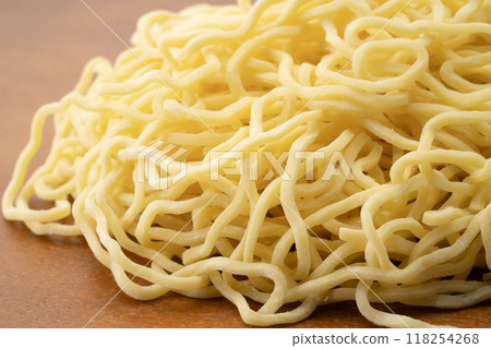 Close-up of raw medium-thick curly noodles Close-up of raw medium-thick curly noodles 118254268
