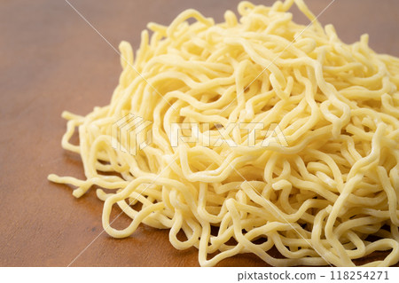 Close-up of raw medium-thick curly noodles Close-up of raw medium-thick curly noodles 118254271