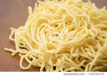 Close-up of raw medium-thick curly noodles Close-up of raw medium-thick curly noodles 118254273