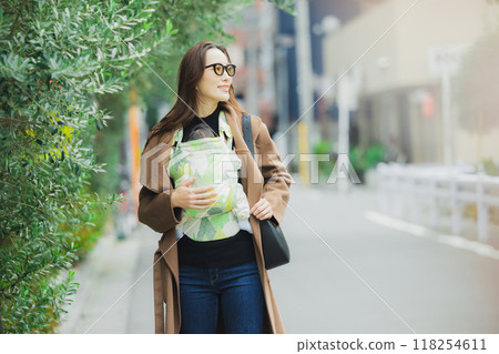 Mother walking with baby 118254611