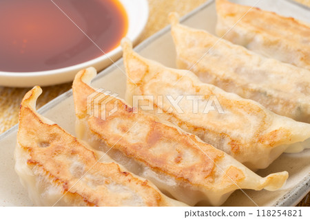Delicious looking roasted dumplings Delicious looking roasted dumplings 118254821