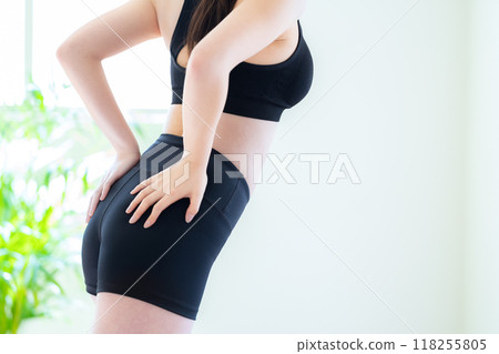 Young woman on a diet in the living room Young woman on a diet in the living room 118255805