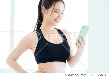 Young woman on a diet in the living room 118255811