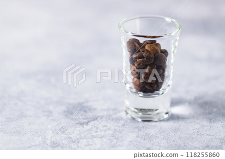 Aromatic flavorful Roasted Specialty Coffee Beans on white Background 118255860