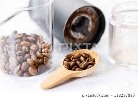 Aromatic flavorful Roasted Specialty Coffee Beans with grinder on white Background 118255880