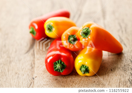 Colorful Sweet Pepper Chili, Baby Small Bell Pepper on wooden background Colorful Sweet Pepper Chili, Baby Small Bell Pepper on wooden background 118255922
