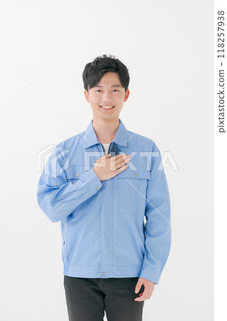 A young man wearing work clothes A young man wearing work clothes 118257938