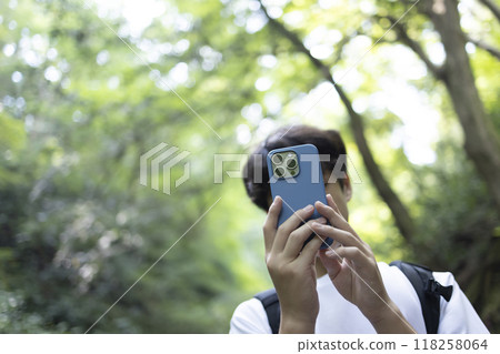 A boy climbing a mountain A boy climbing a mountain 118258064
