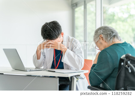 A male doctor who is troubled and depressed while examining a senior female patient (monster patient, dementia) A male doctor who is troubled and depressed while examining a senior female patient (monster patient, dementia) 118259282