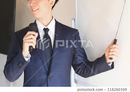 Male seminar lecturer wearing a suit to give a presentation Male seminar lecturer wearing a suit to give a presentation 118260399