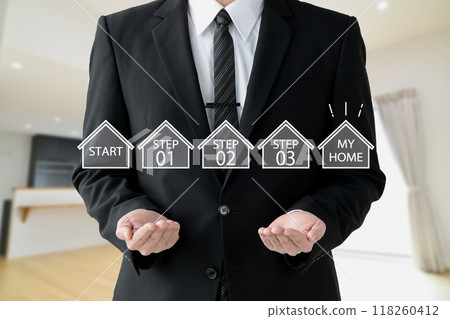 A businessman listing the steps to owning his own home A businessman listing the steps to owning his own home 118260412