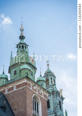 Detailed vertical shot of beautiful medieval castle towers, Krakow, Poland Detailed vertical shot of beautiful medieval castle towers, Krakow, Poland 118260484
