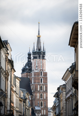 Historical street in old city center with huge tower on its end, Krakow, Poland 118260488