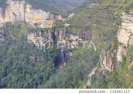 A tranquil waterfall flowing in a valley in the Blue Mountains A tranquil waterfall flowing in a valley in the Blue Mountains 118261127