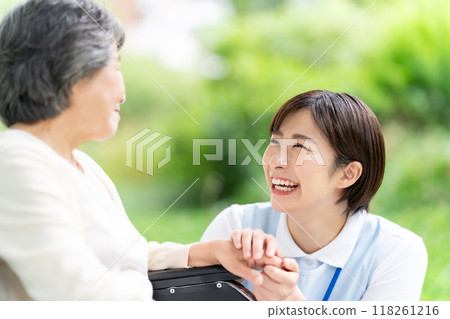 Wheelchair caregiver and senior woman 118261216