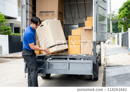 An Asian delivery man or mover is unloading cardboard boxes from his truck. 118261662