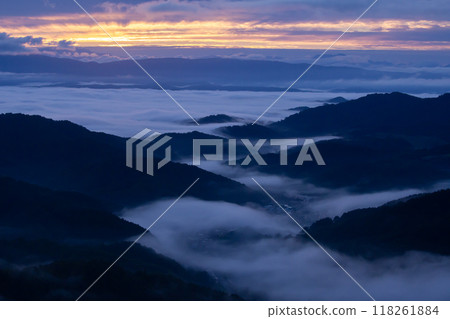 A sea of clouds crawling across the earth 118261884