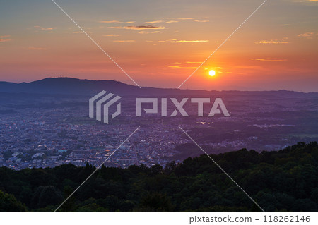 Early autumn evening view of Mount Wakakusa in Nara. From the sunset to the beautiful sunset sky and night view as the sun sinks into the foothills of Mount Ikoma #3 118262146