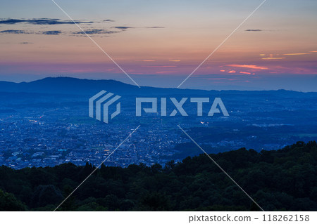 Early autumn evening view of Mount Wakakusa in Nara. From the sunset sinking into the foothills of Mount Ikoma through the beautiful sunset sky to the night view #15 Early autumn evening view of Mount Wakakusa in Nara. From the sunset sinking into the foothills of Mount Ikoma through the beautiful sunset sky to the night view #15 118262158