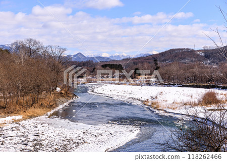 Mt. Horoshiri and the Hidaka Mountains towering behind the Saru River in Biratori Town, Hokkaido [February] 118262466